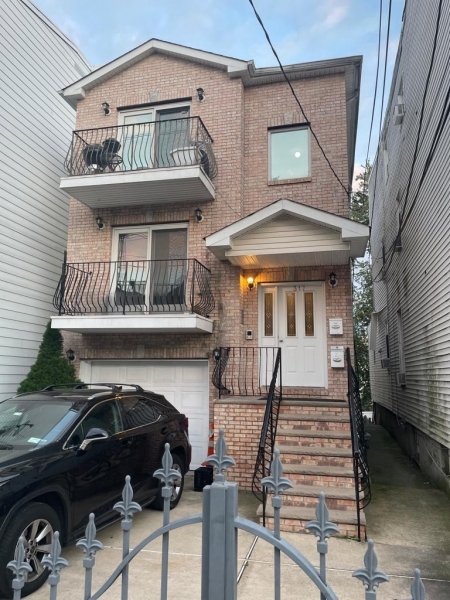 a front view of a house with roof deck