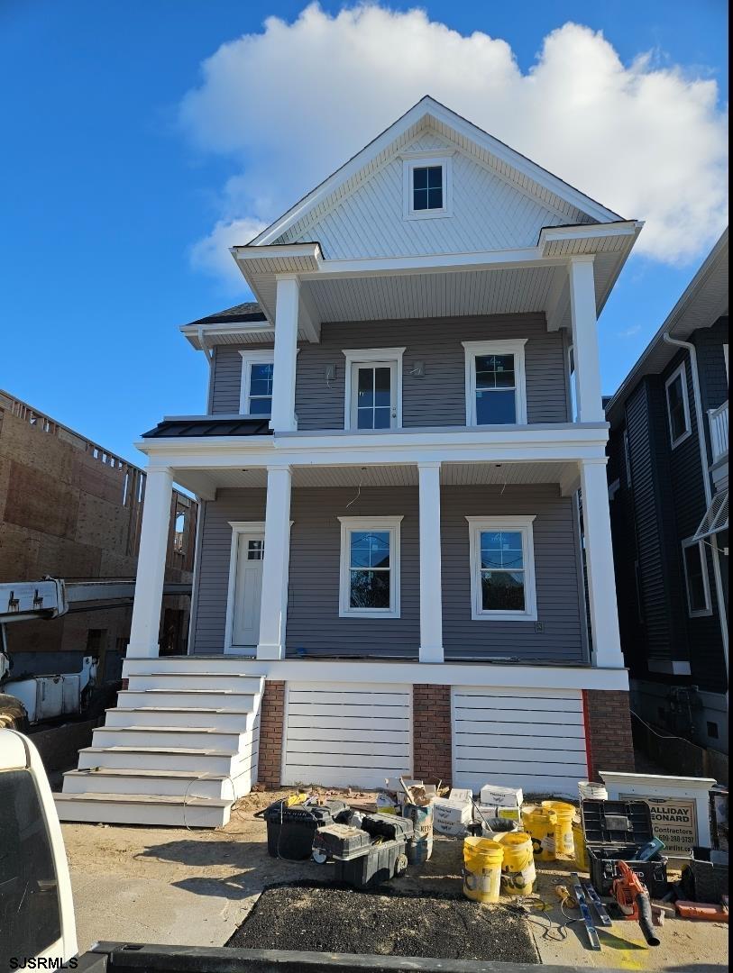 a front view of a house with glass windows