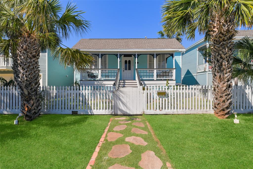 front view of a house with a garden