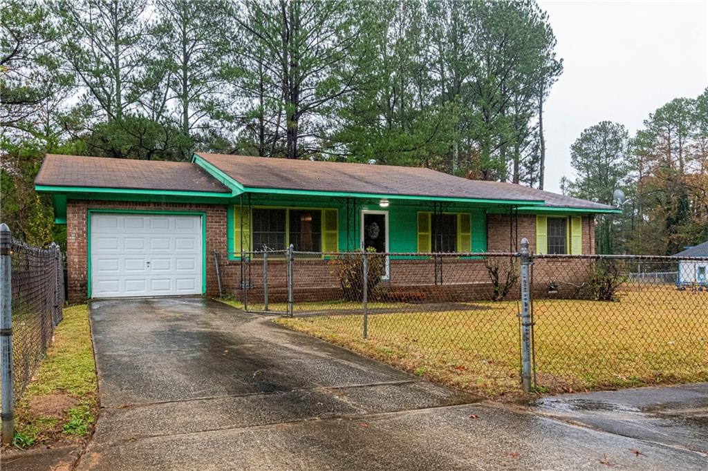 a house that has a tree in front of it