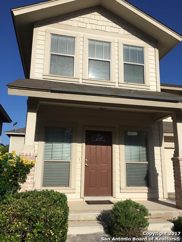 a front view of a house with a garage