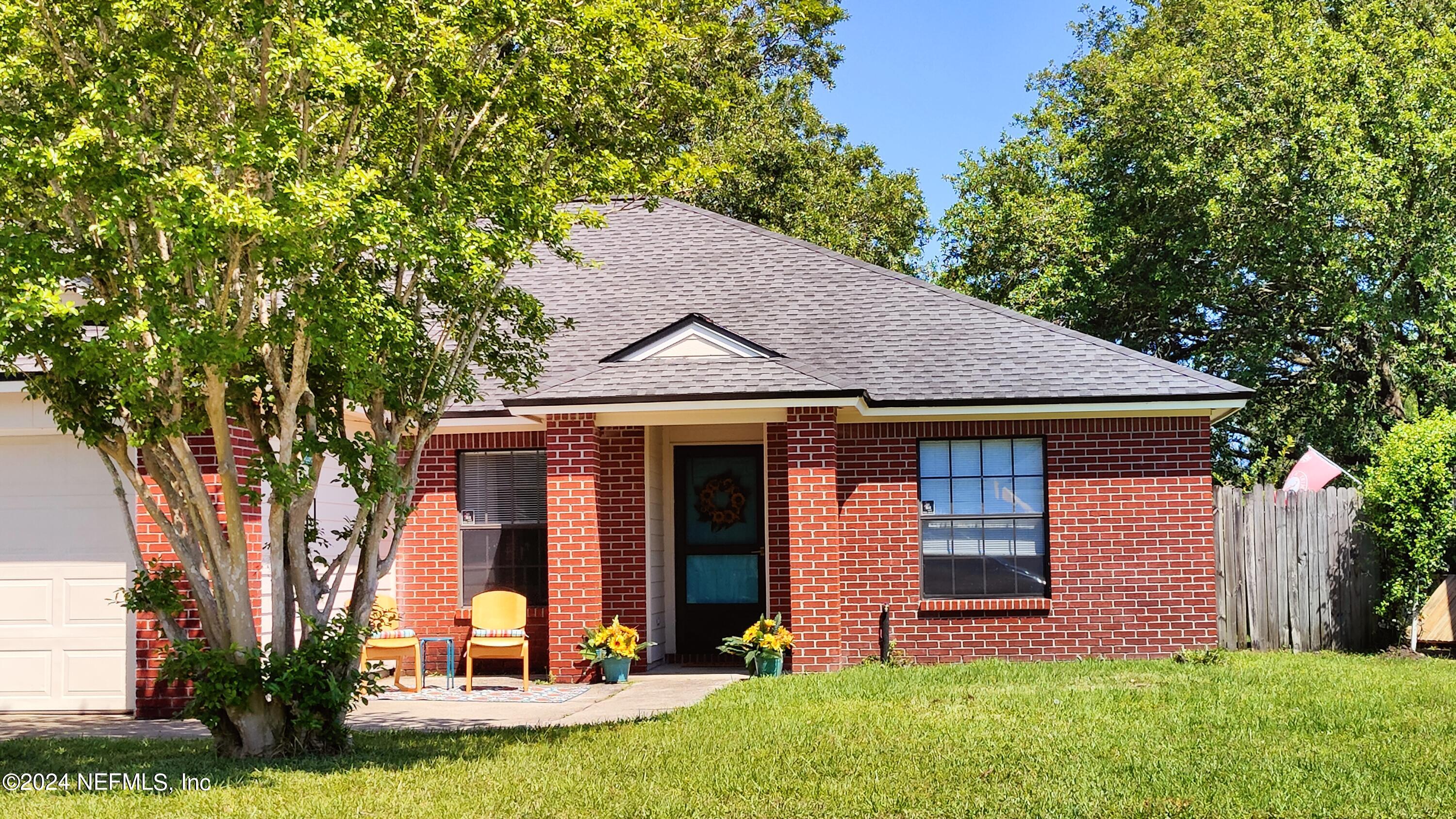 front view of a house with a yard