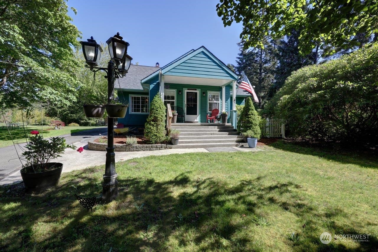 a front view of a house with garden