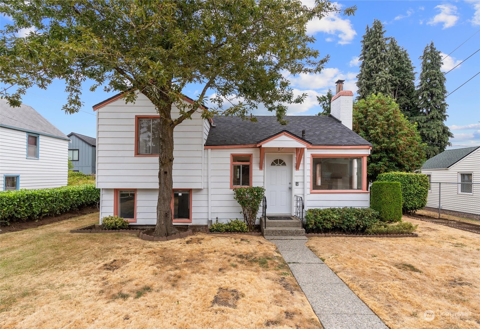 a front view of a house with a yard