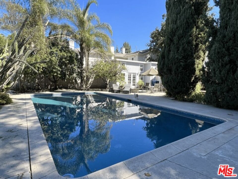 a view of swimming pool with a sitting area