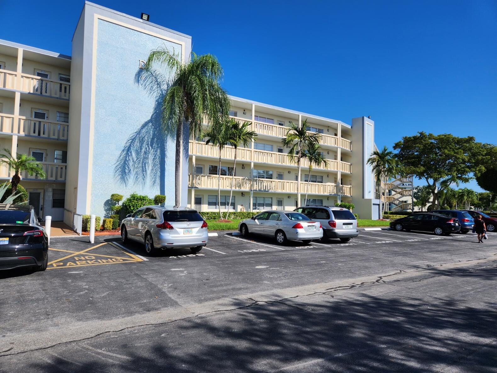 a view of a car is parked in front of a building