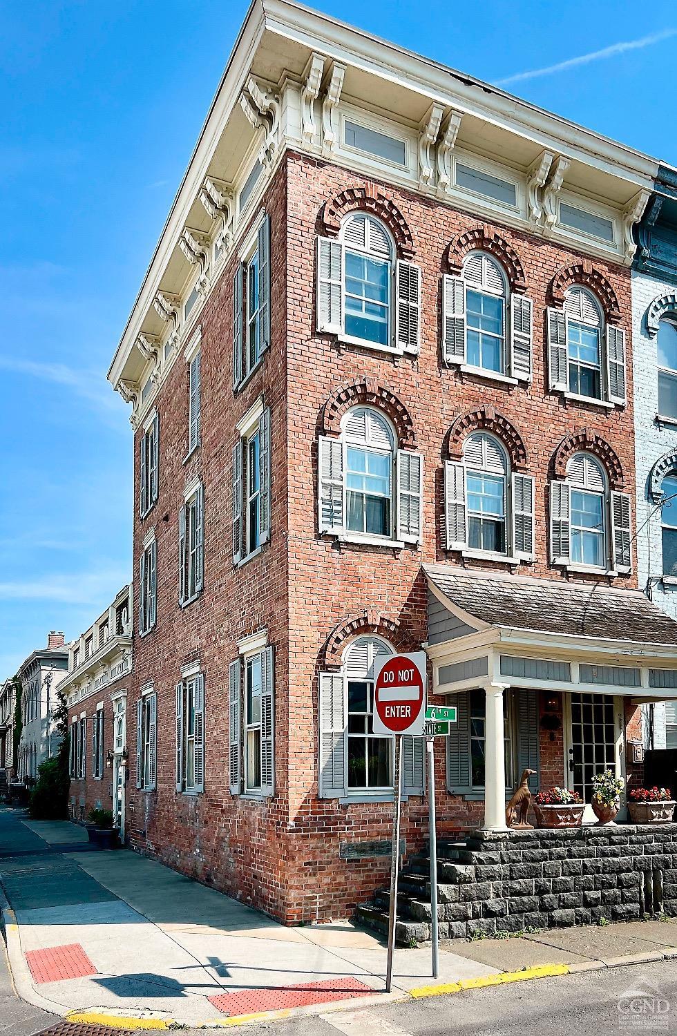 a front view of a building and street view