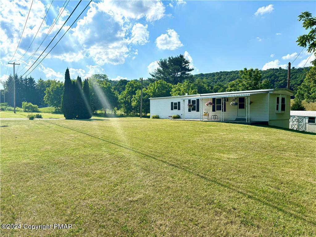 a view of a house with a big yard