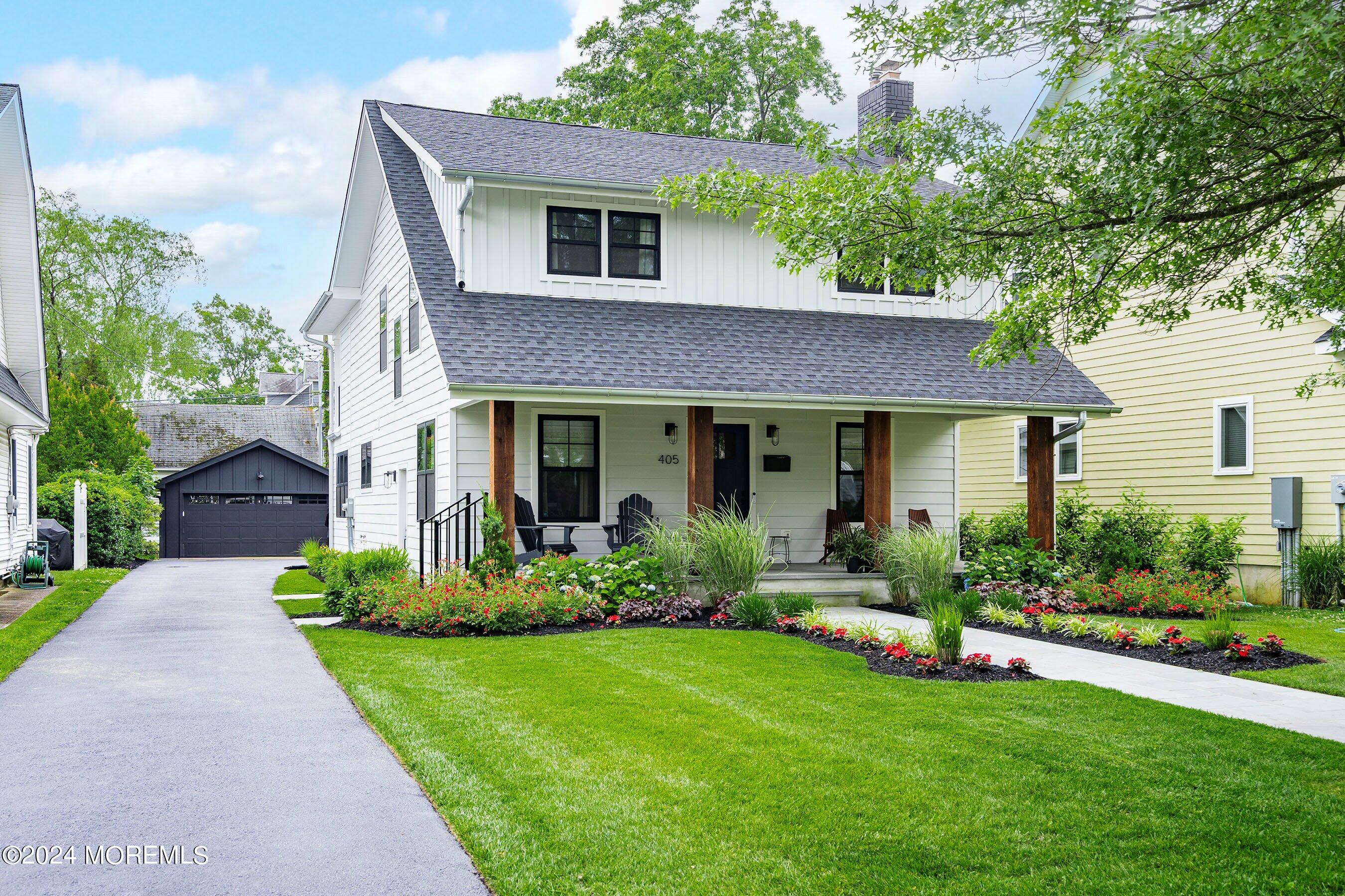 a front view of a house with a yard and porch