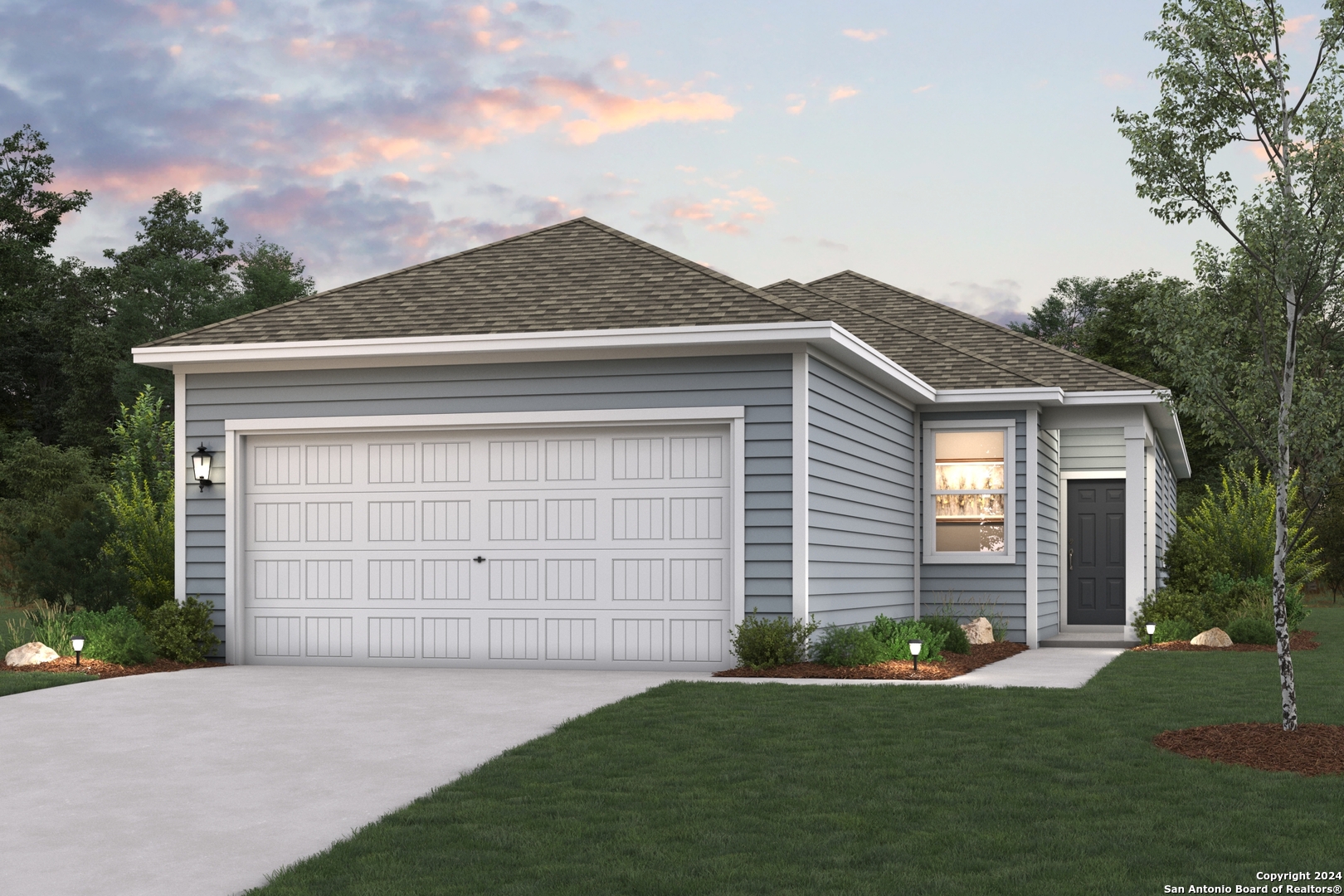 a front view of a house with a yard and garage