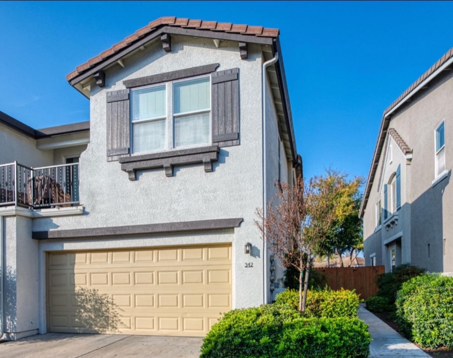 a front view of a house with a garage