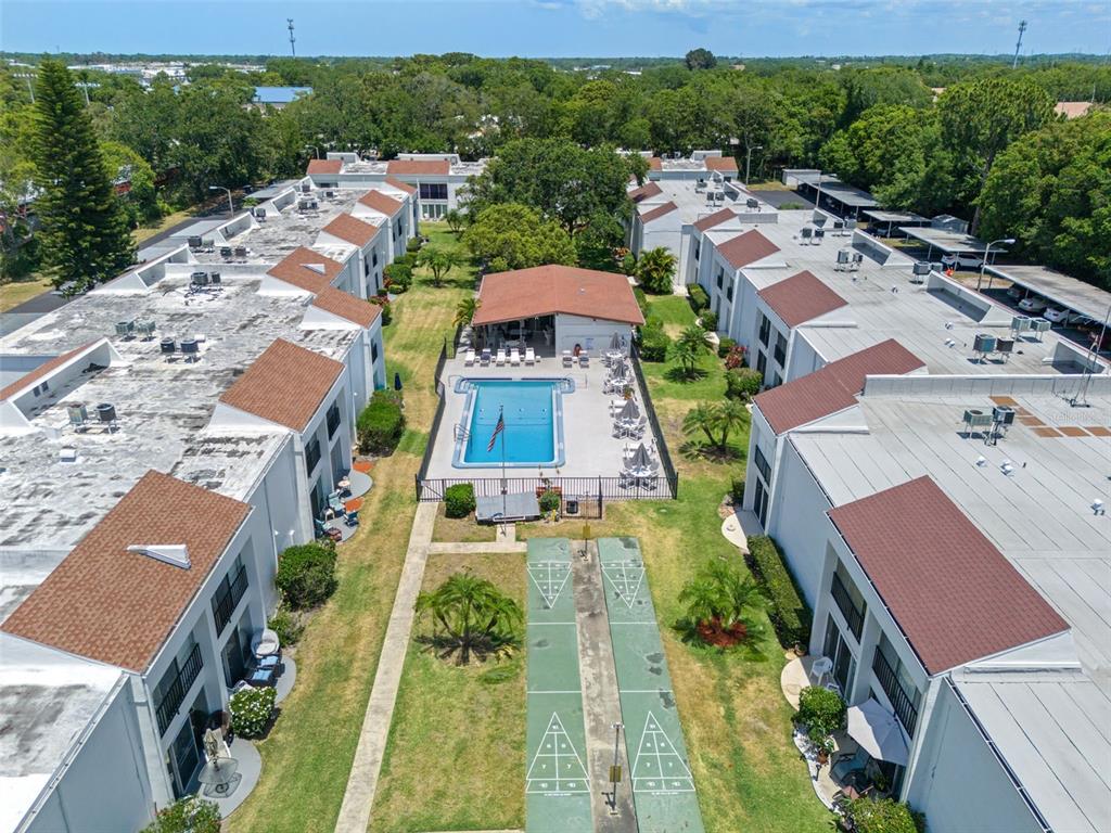 an aerial view of residential houses with outdoor space