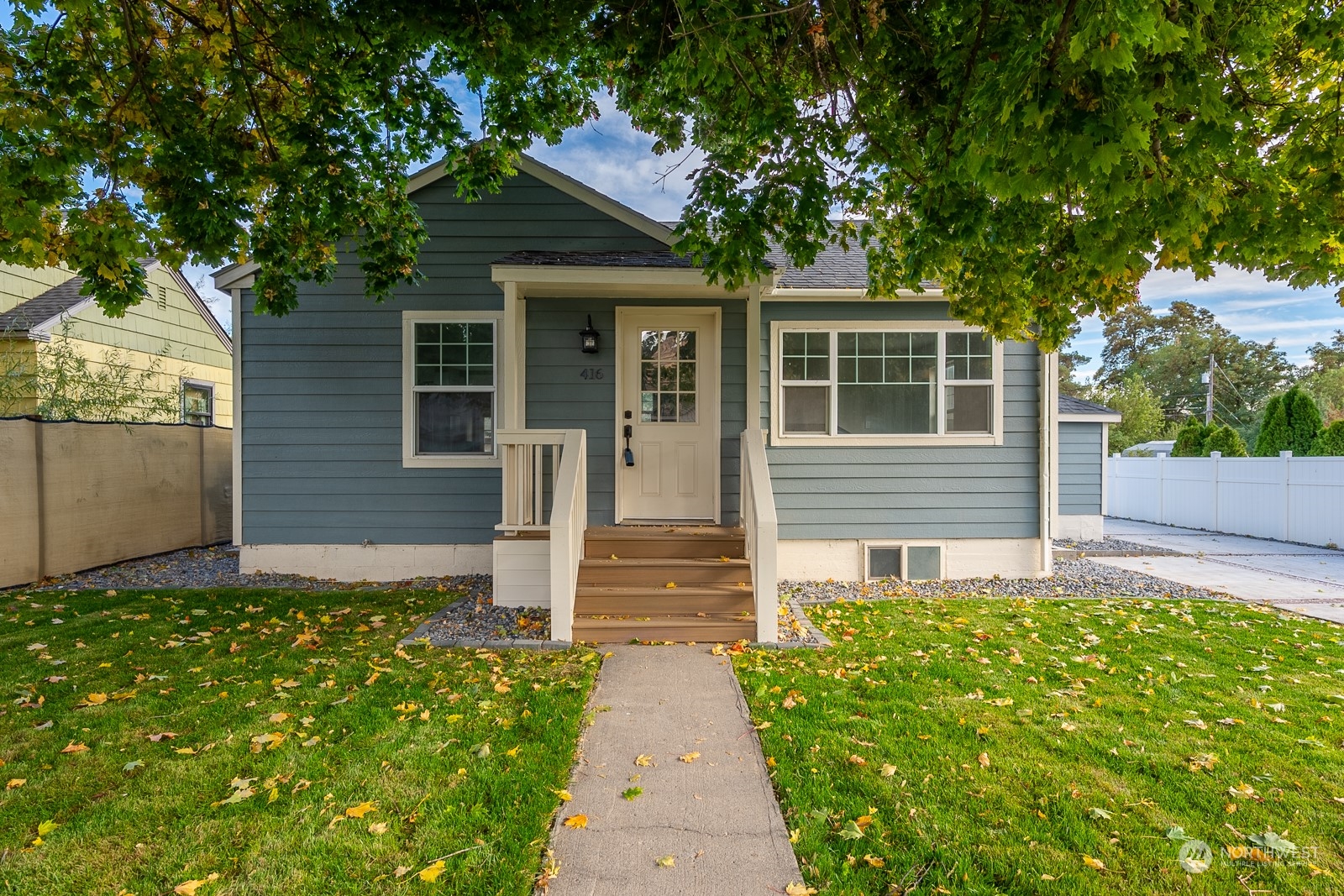 front view of a house with a yard