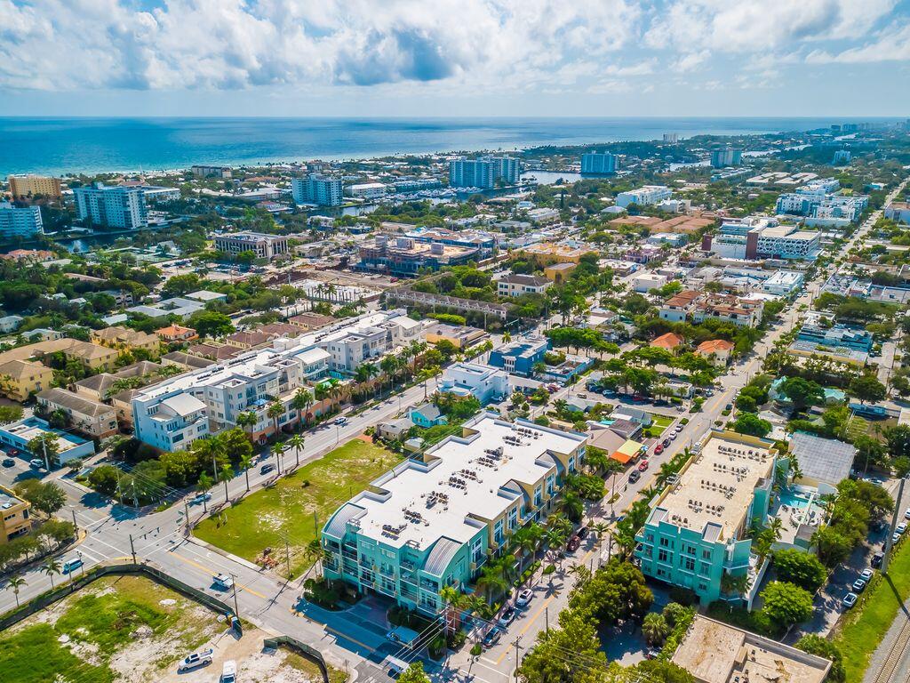 an aerial view of residential houses with outdoor space