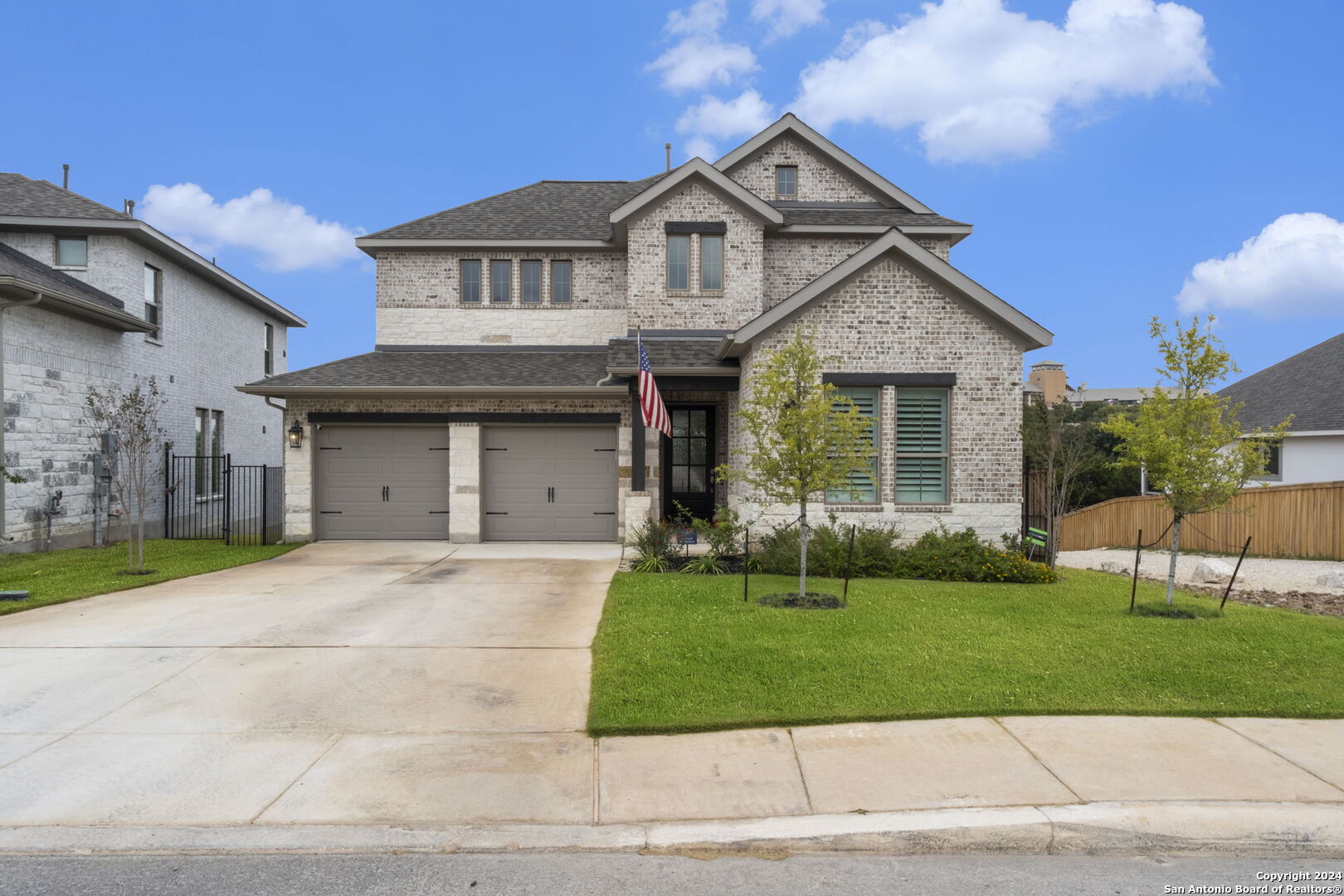 a front view of a house with a yard