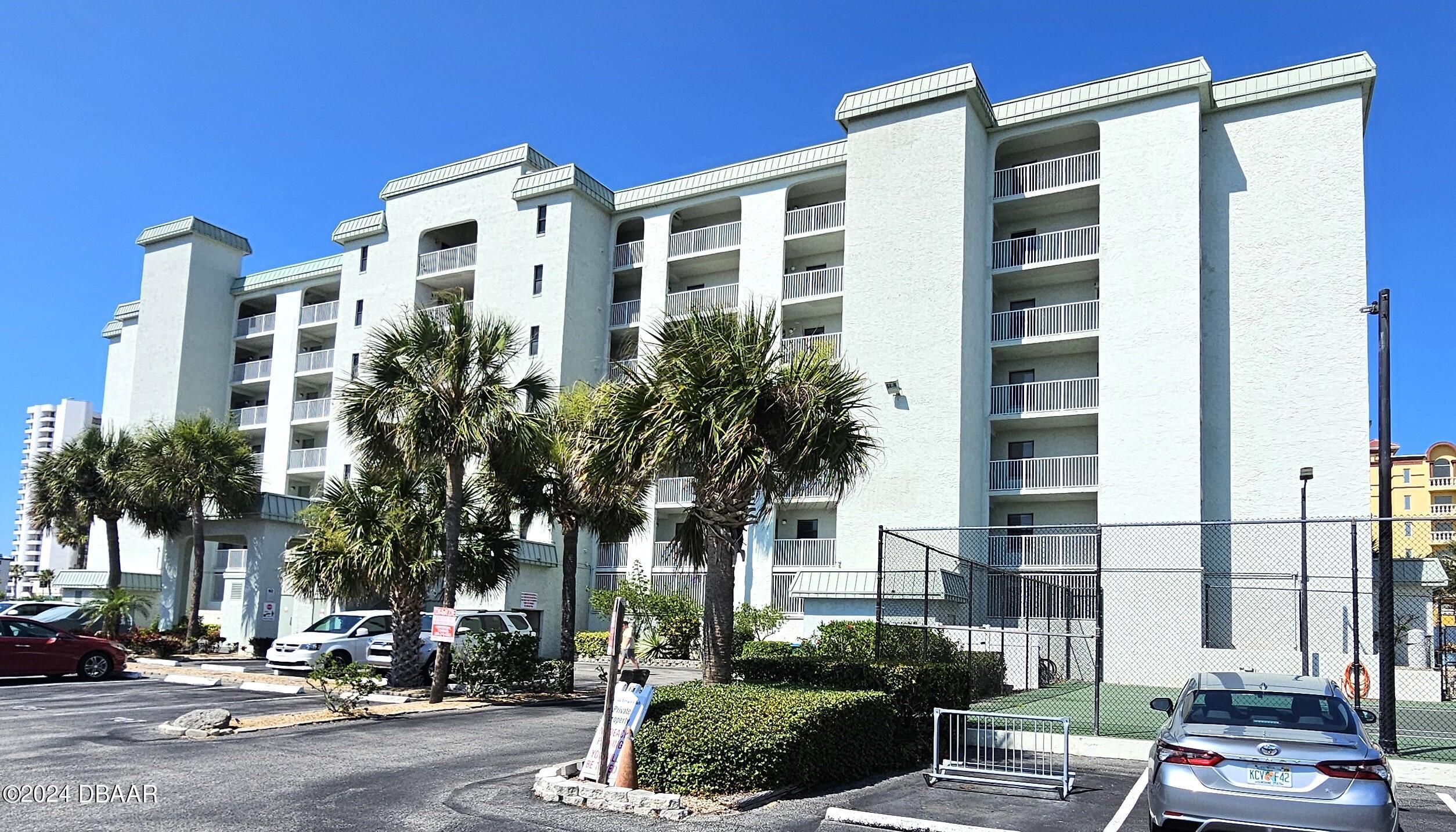 a front view of a building with street view