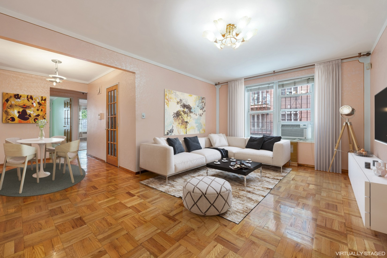 a living room with furniture a flat screen tv and a dining table