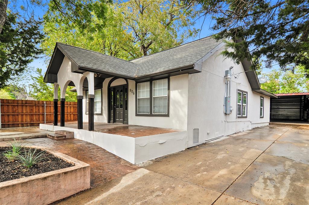 a front view of house with yard outdoor seating and barbeque oven