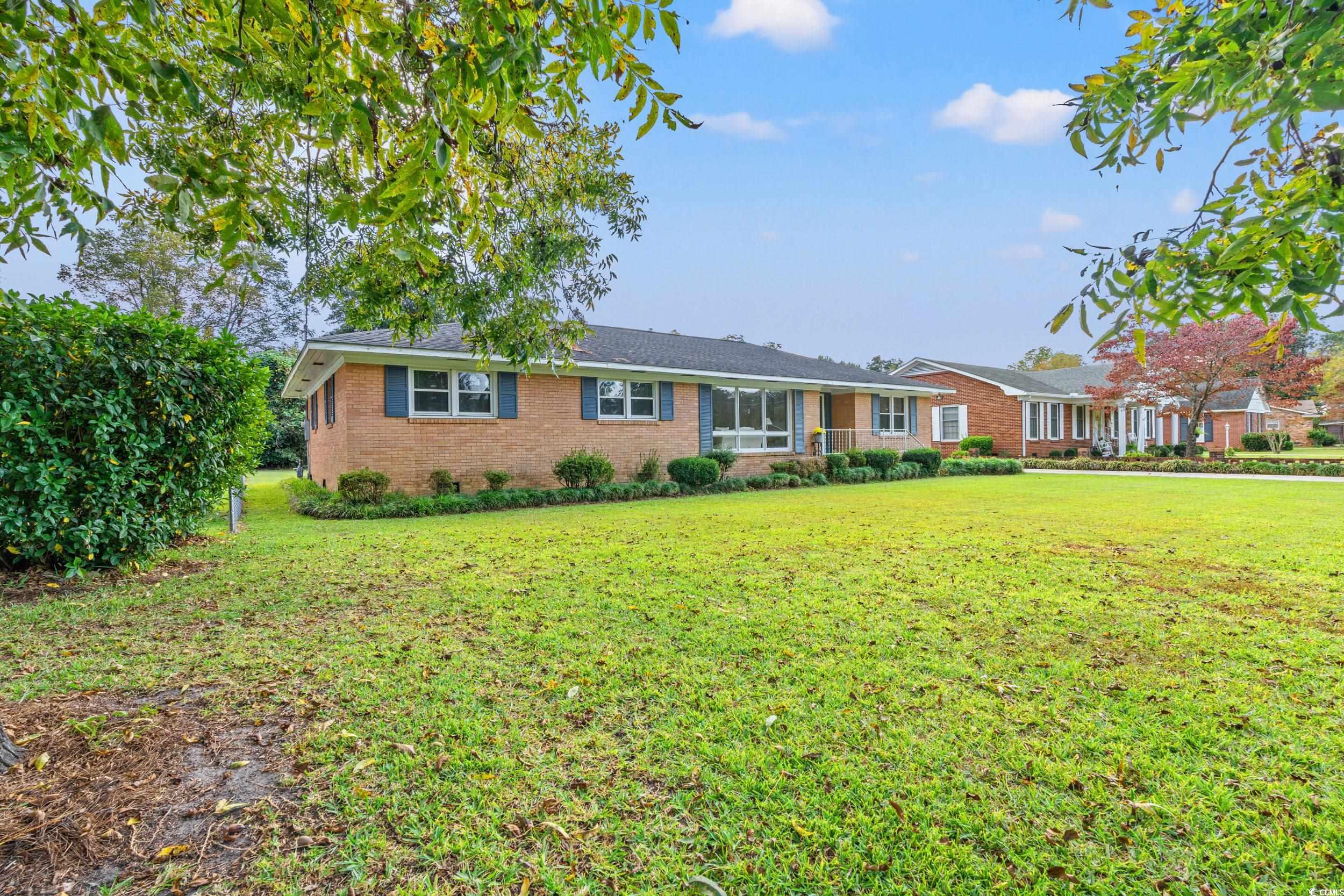 Ranch-style house featuring a front yard