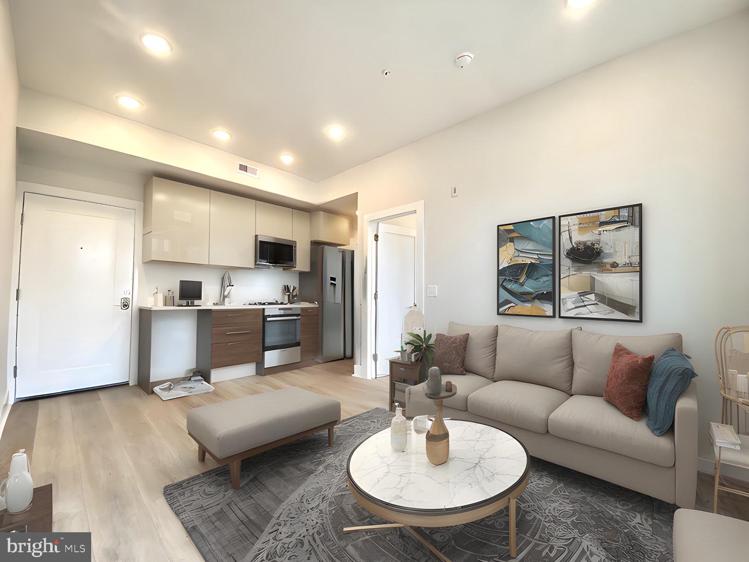 a living room with furniture and a dining table with wooden floor