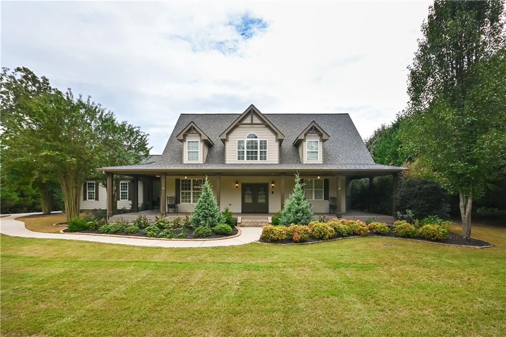 a front view of house with yard and green space