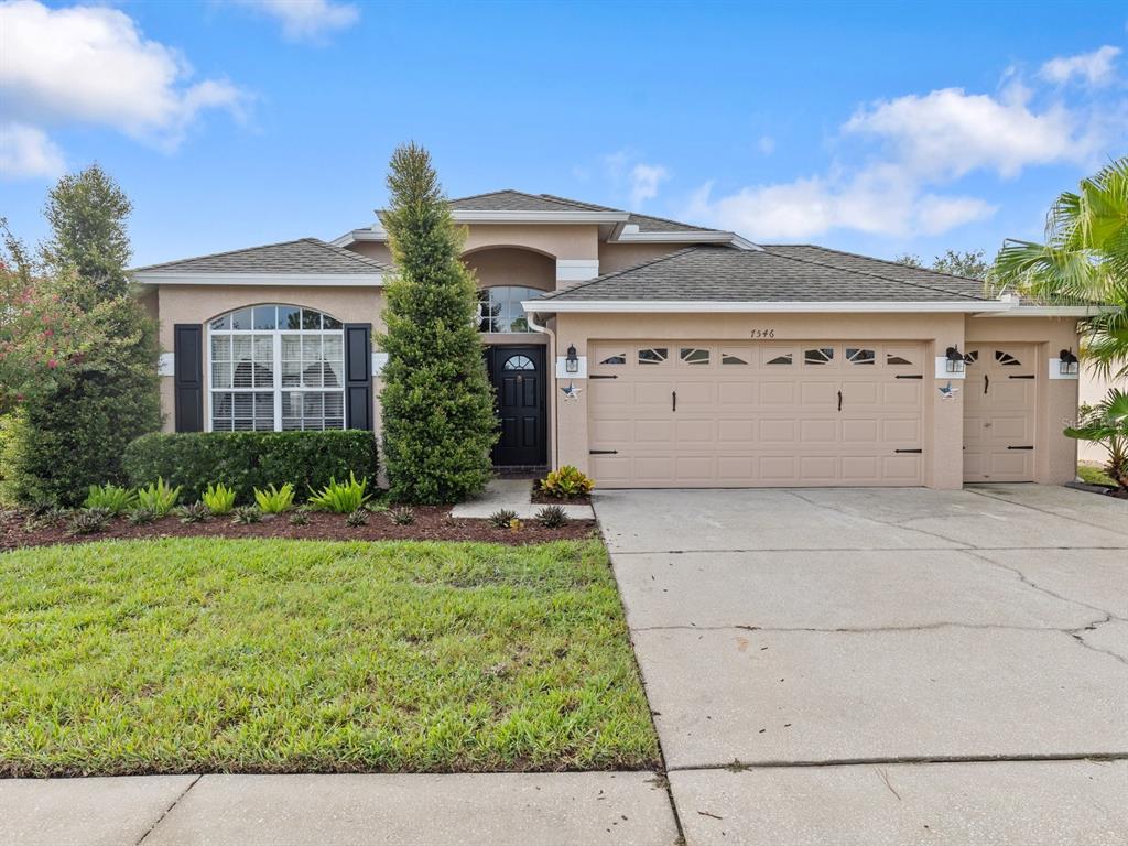 front view of a house with a yard