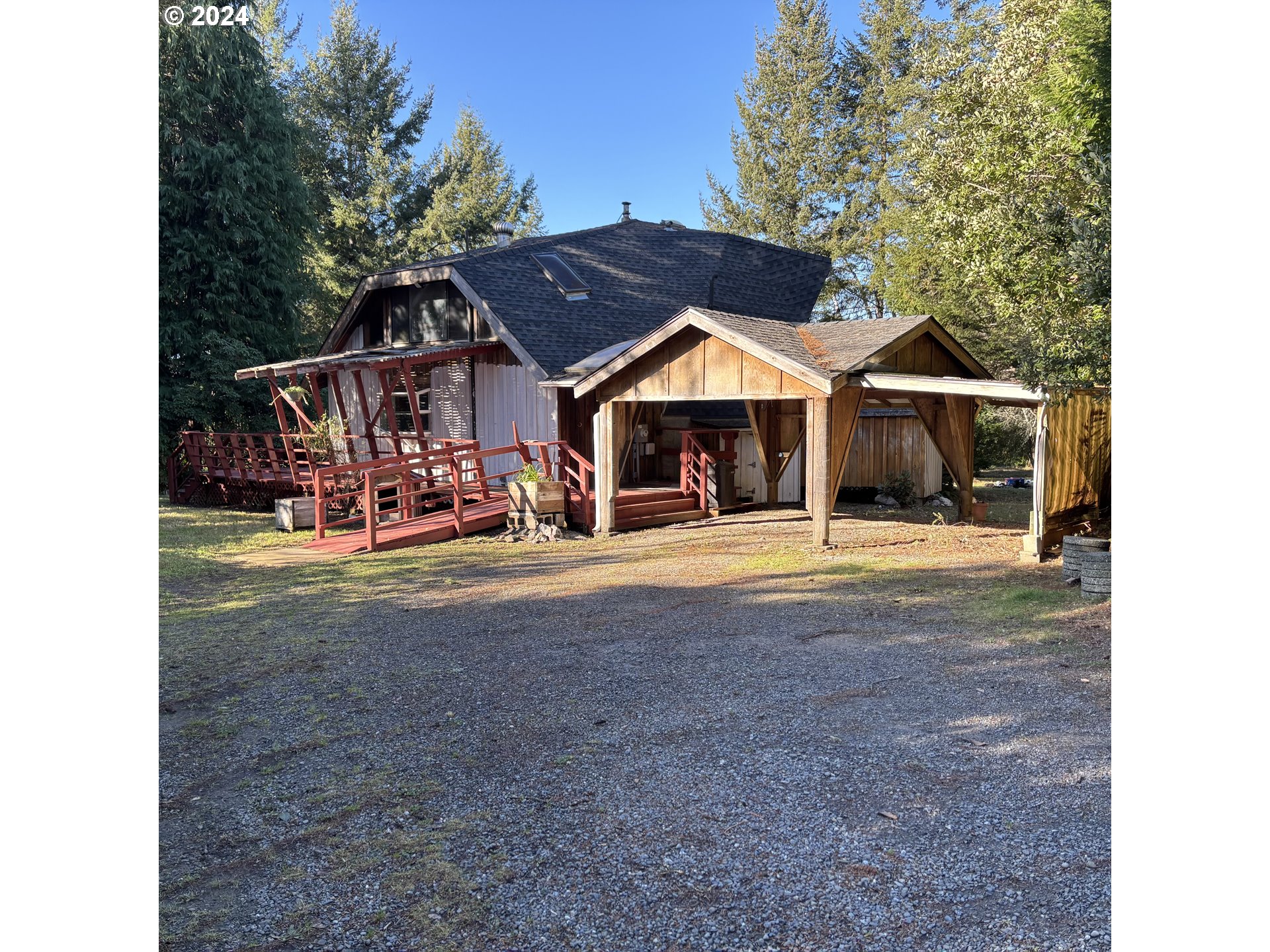 a view of a house with a yard patio and sitting area