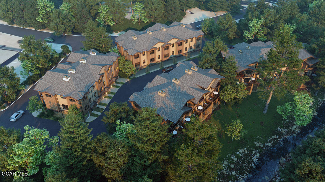 an aerial view of house with yard swimming pool and outdoor seating