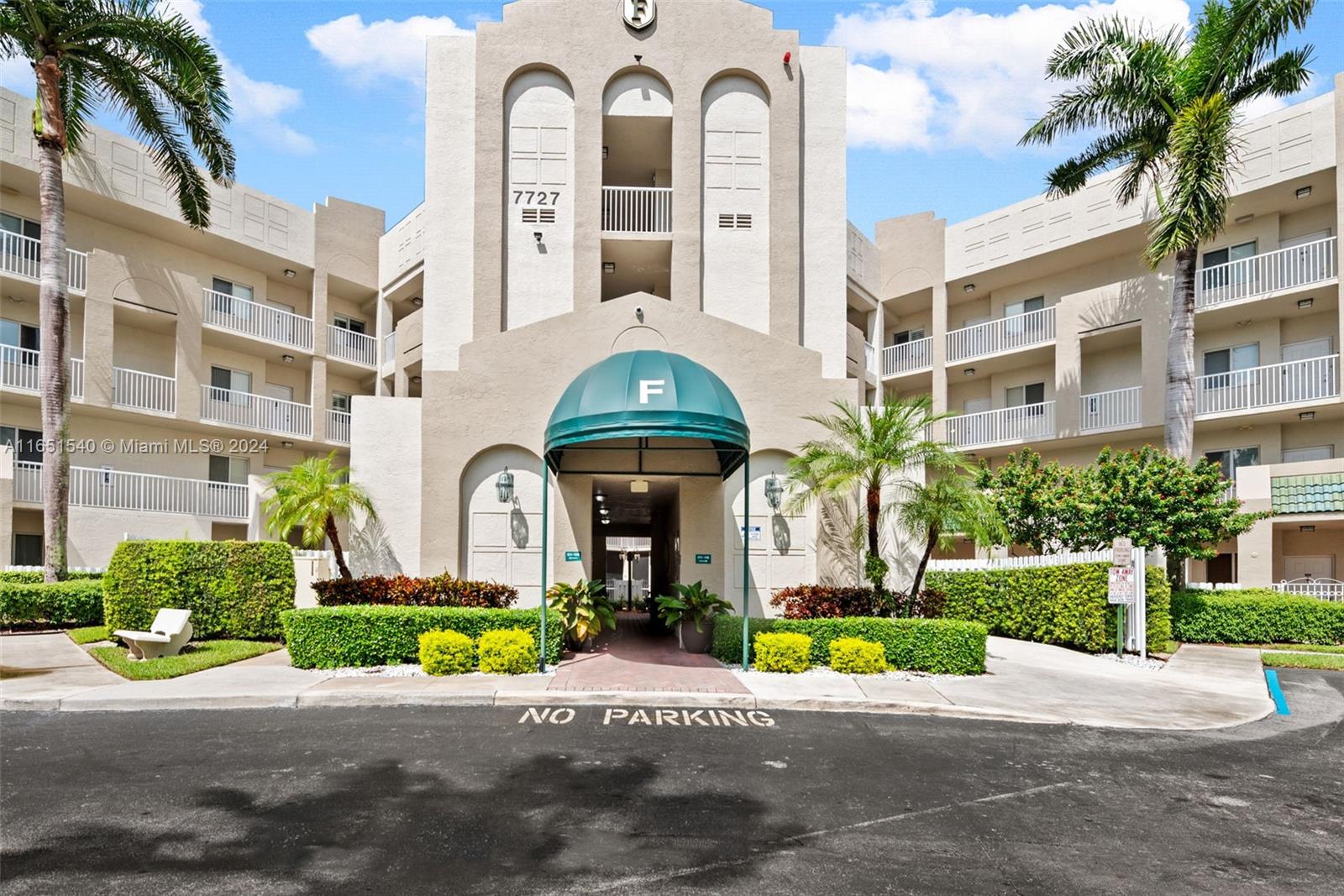 a front view of a building with garden