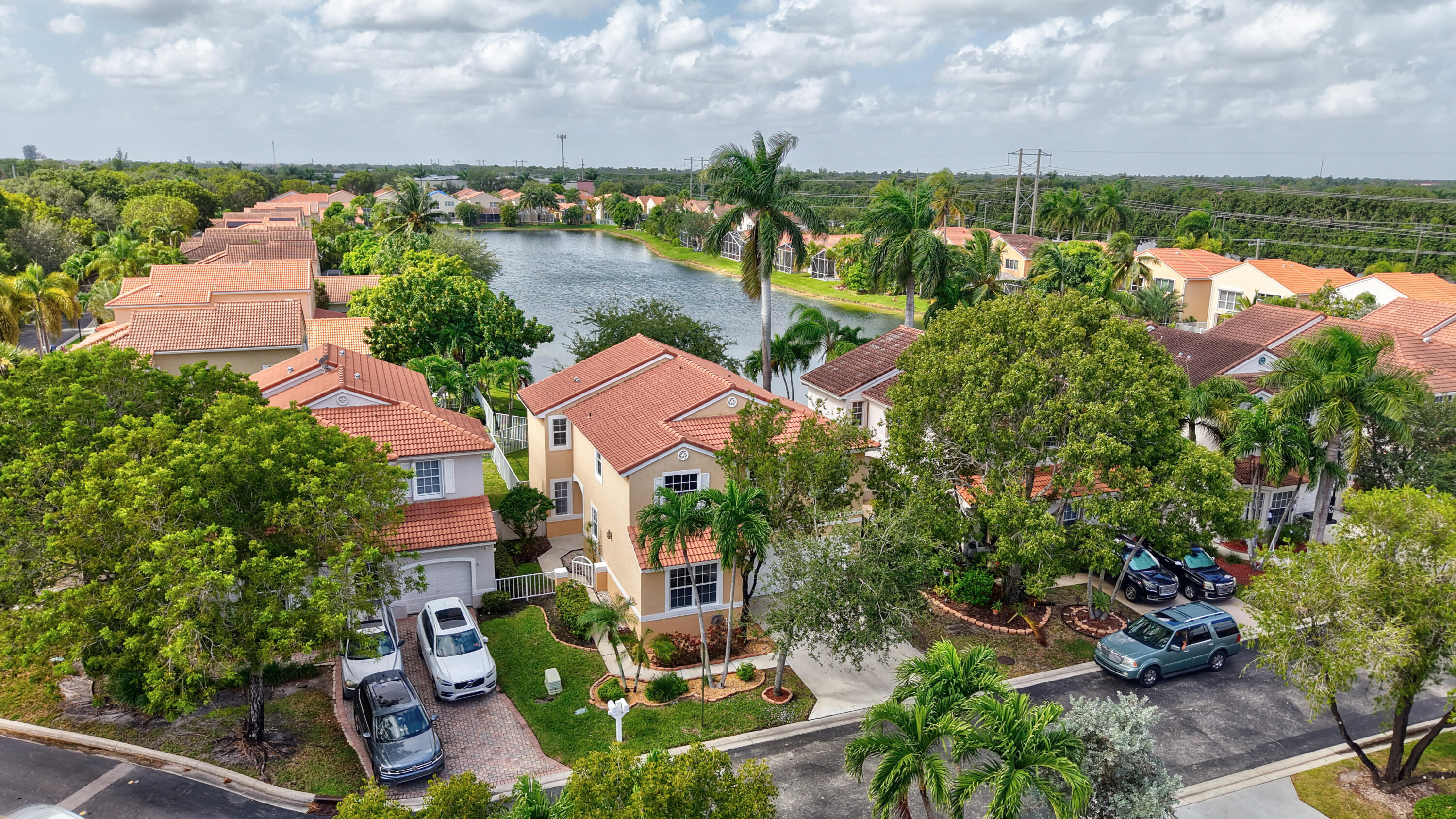 an aerial view of multiple houses with yard