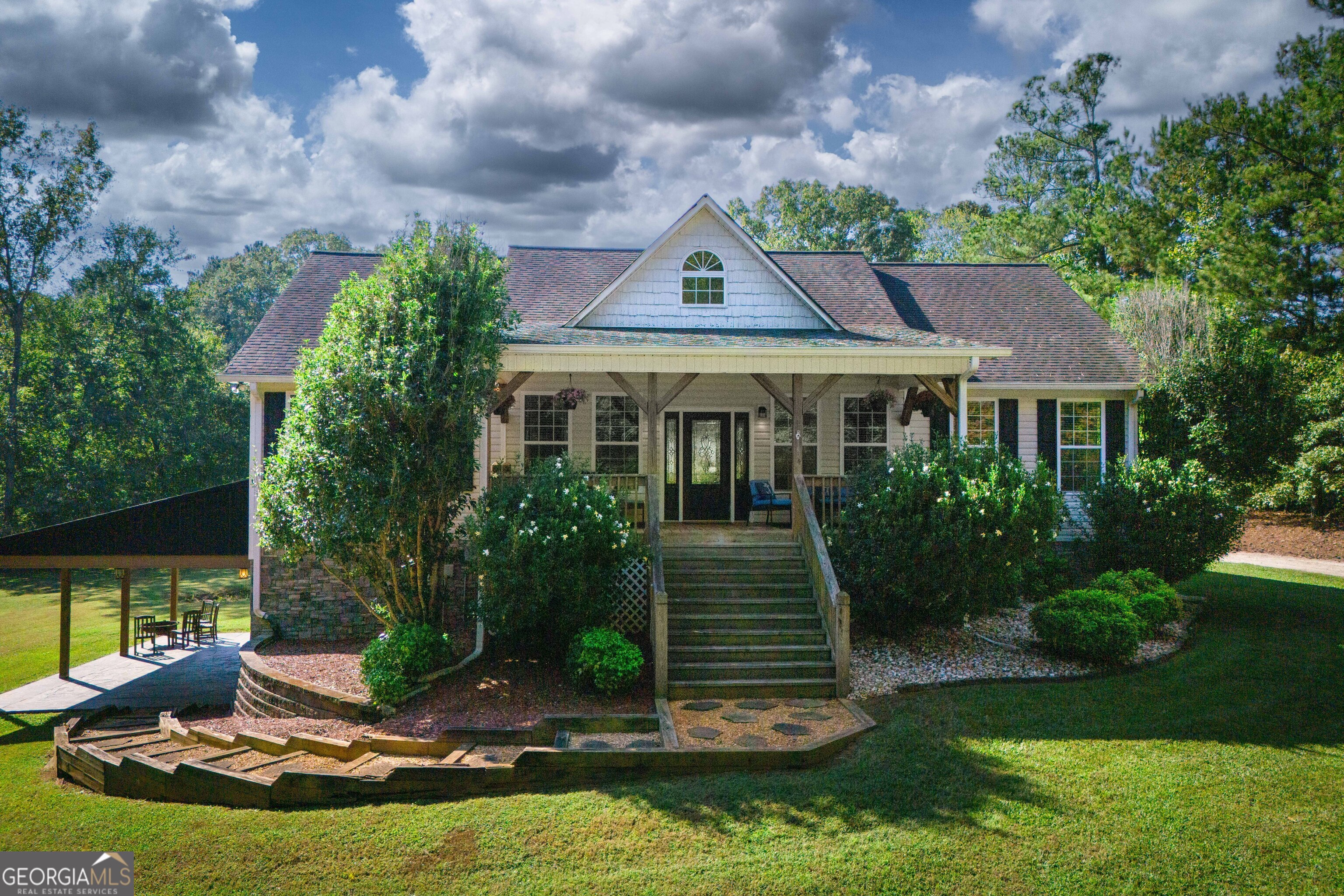 a front view of house with yard and green space