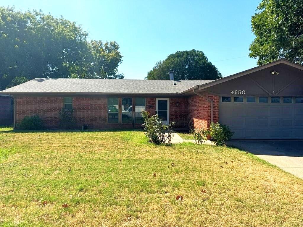 a view of a house with pool and a yard