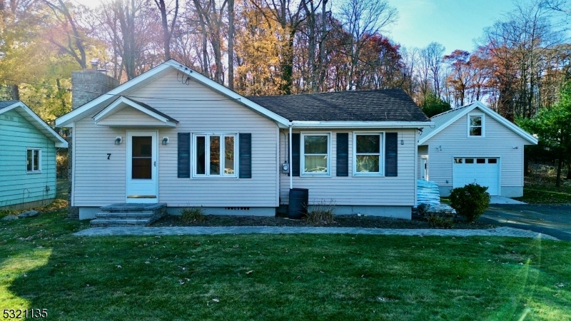 a view of front of house with a yard