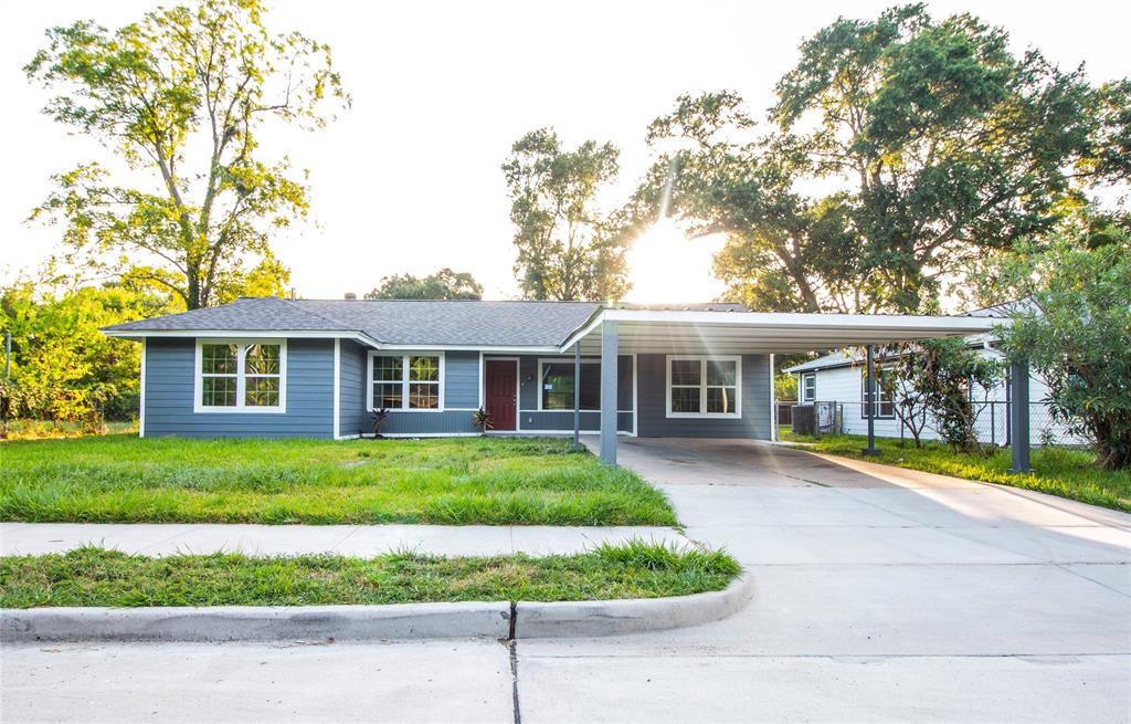 front view of a house with a garden