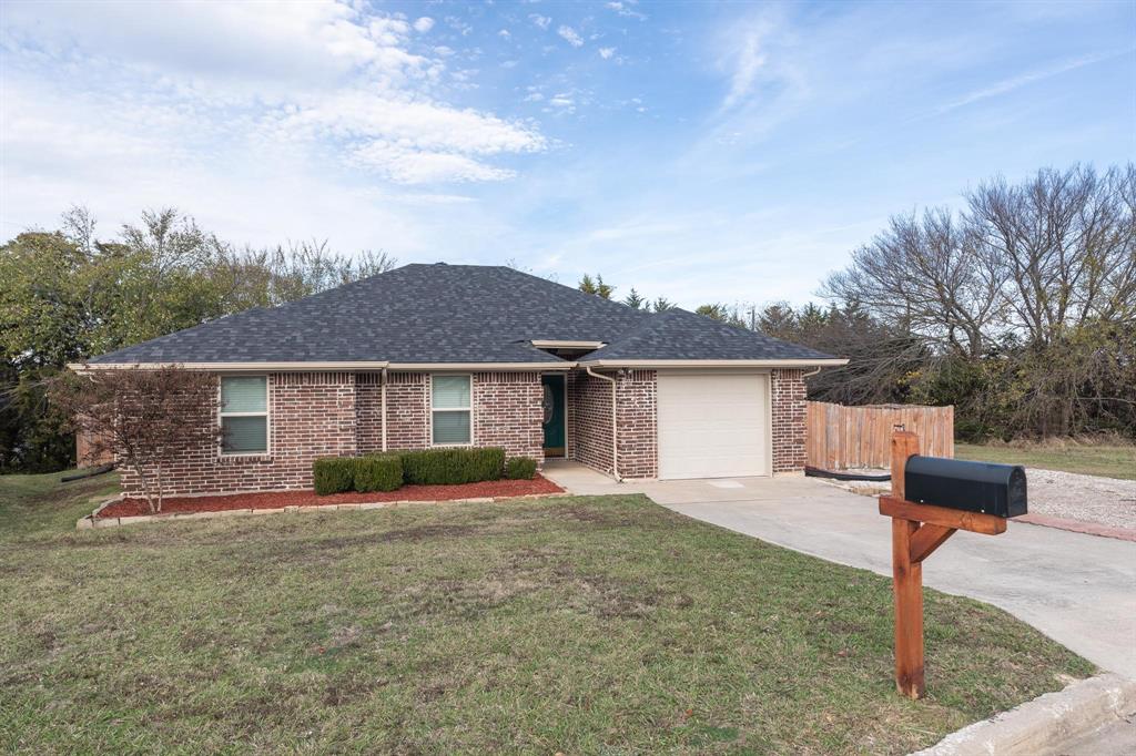 front view of a house with a yard