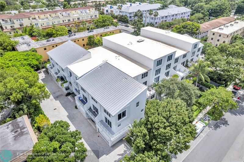 an aerial view of a house with a garden