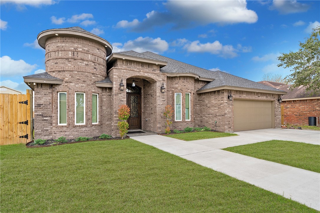 a front view of a house with a yard