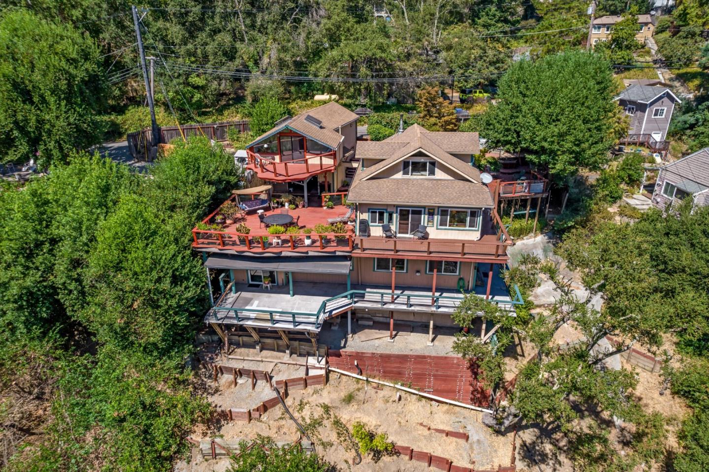 an aerial view of a house with swimming pool patio and outdoor seating