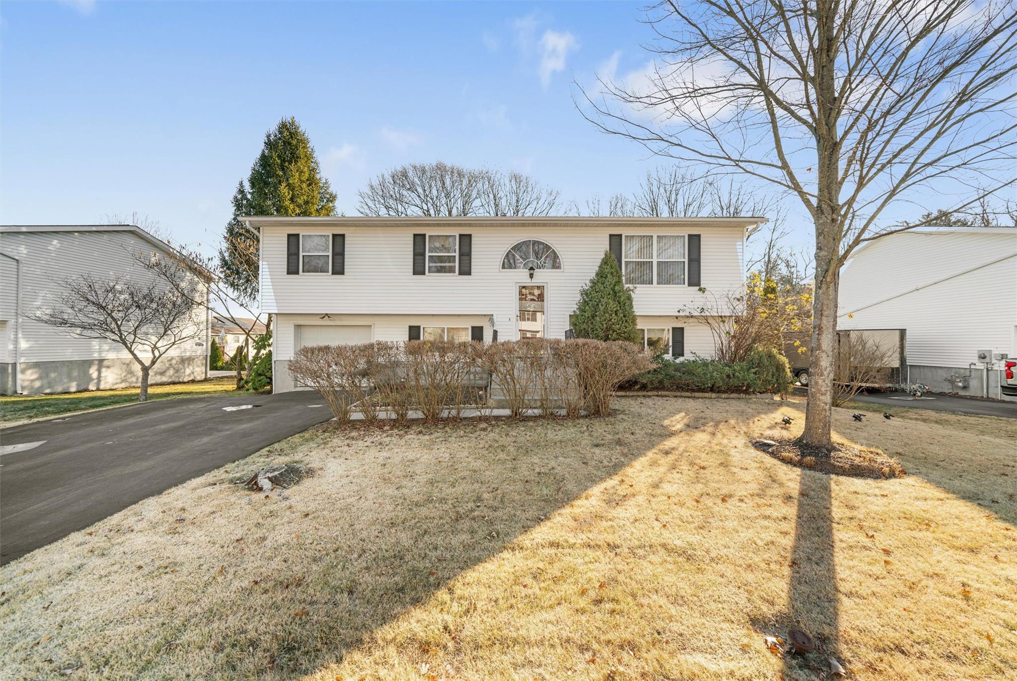 a view of a yard in front of a house