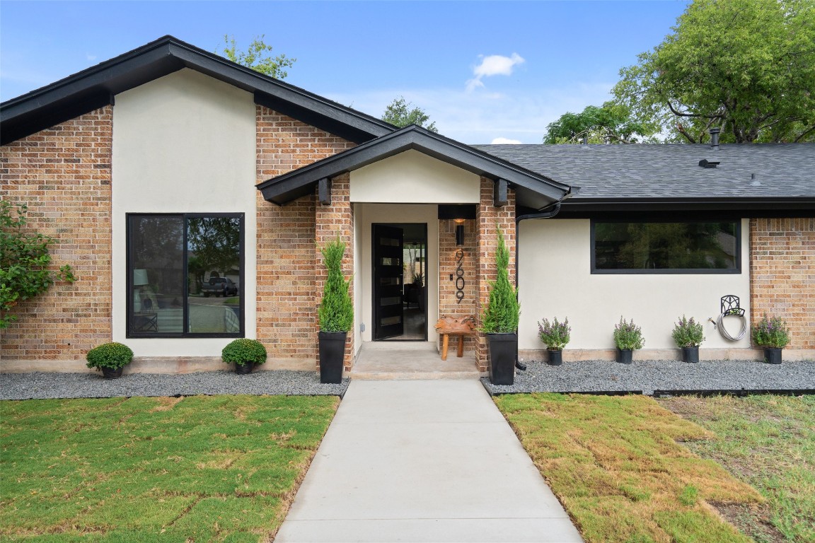 a front view of a house with garden