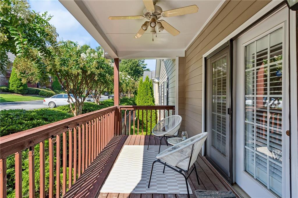 a view of balcony with furniture