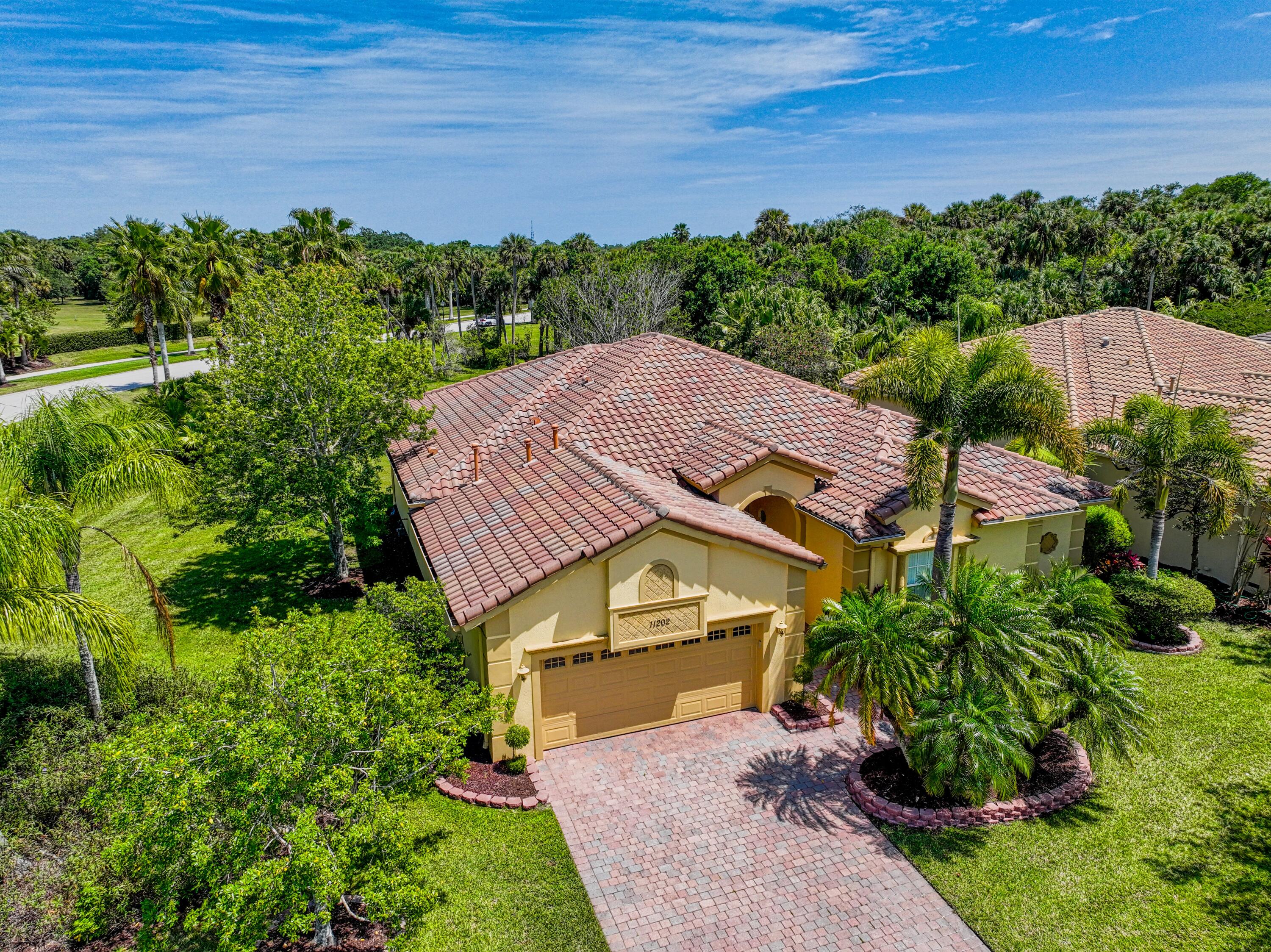 an aerial view of a house with a garden