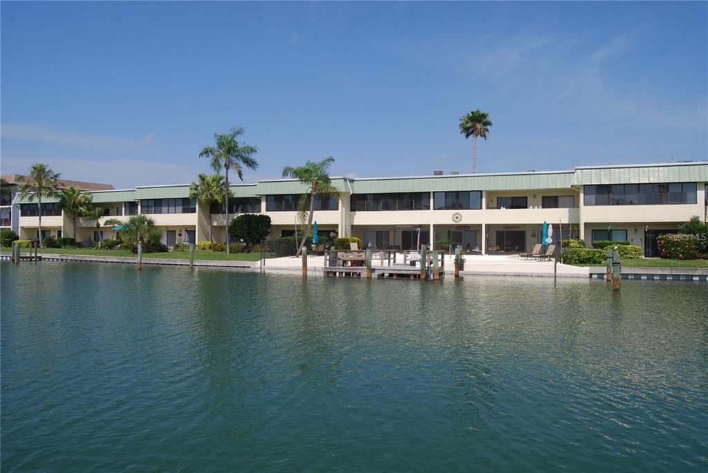 a view of house with yard and ocean view