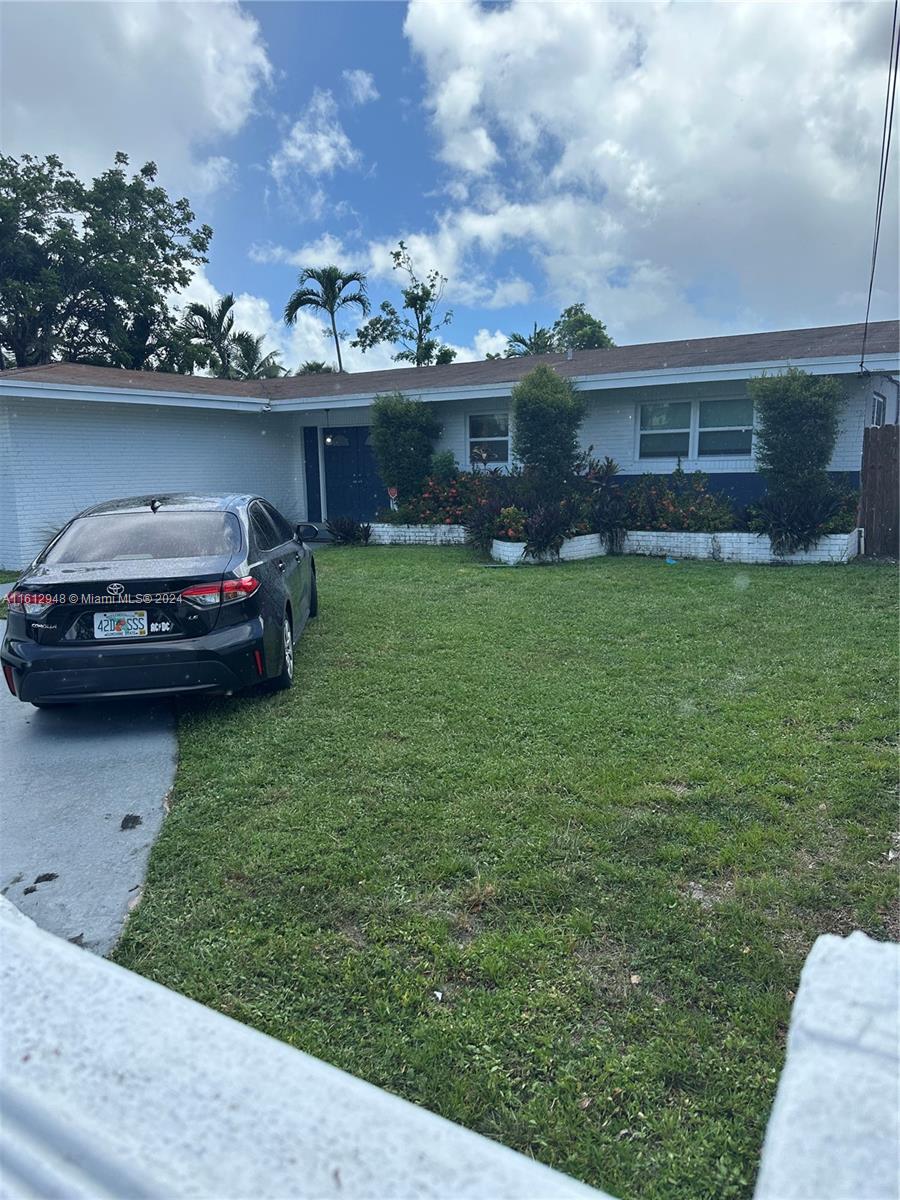 a car parked in front of a house