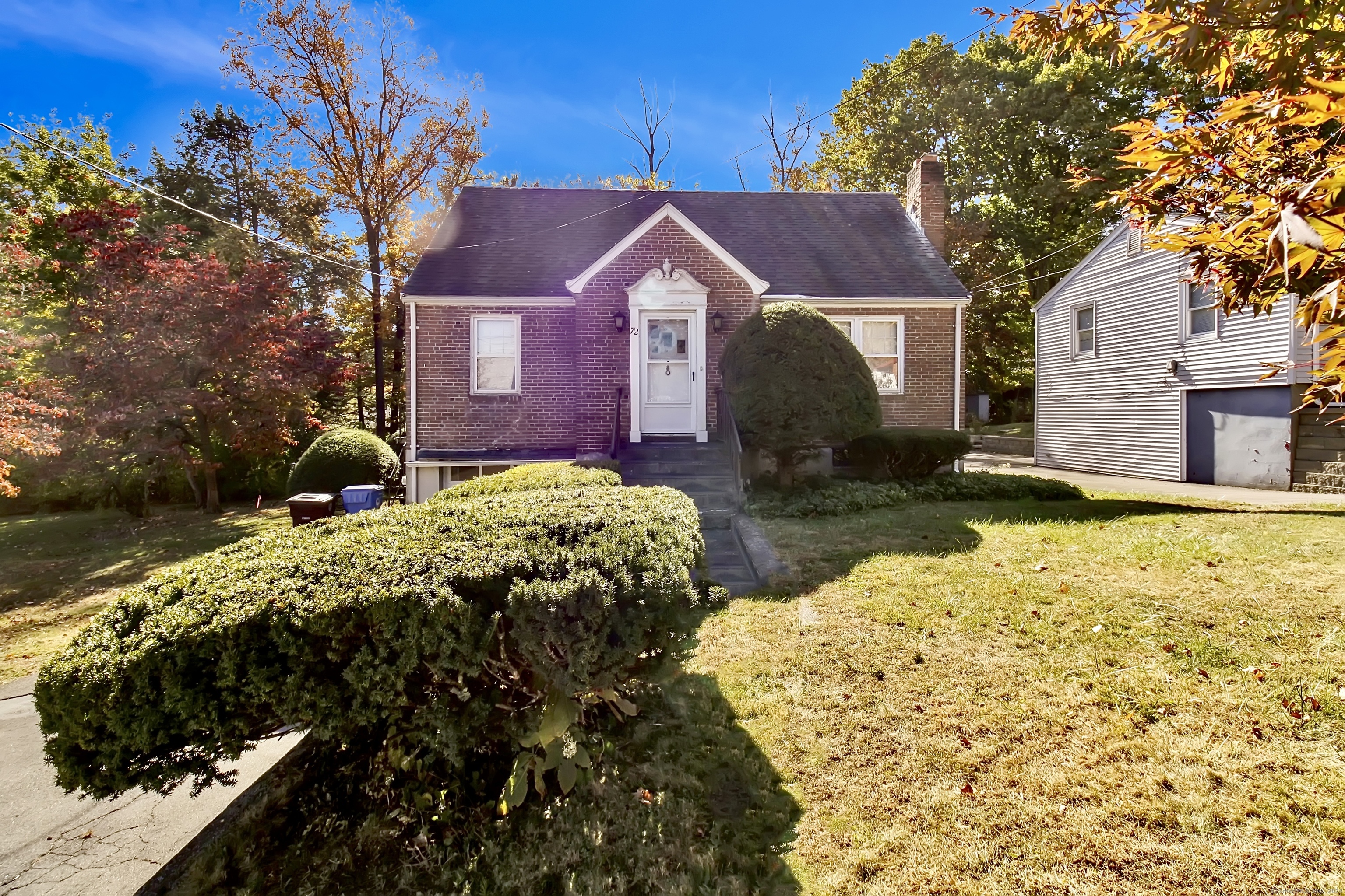 a front view of a house with a yard