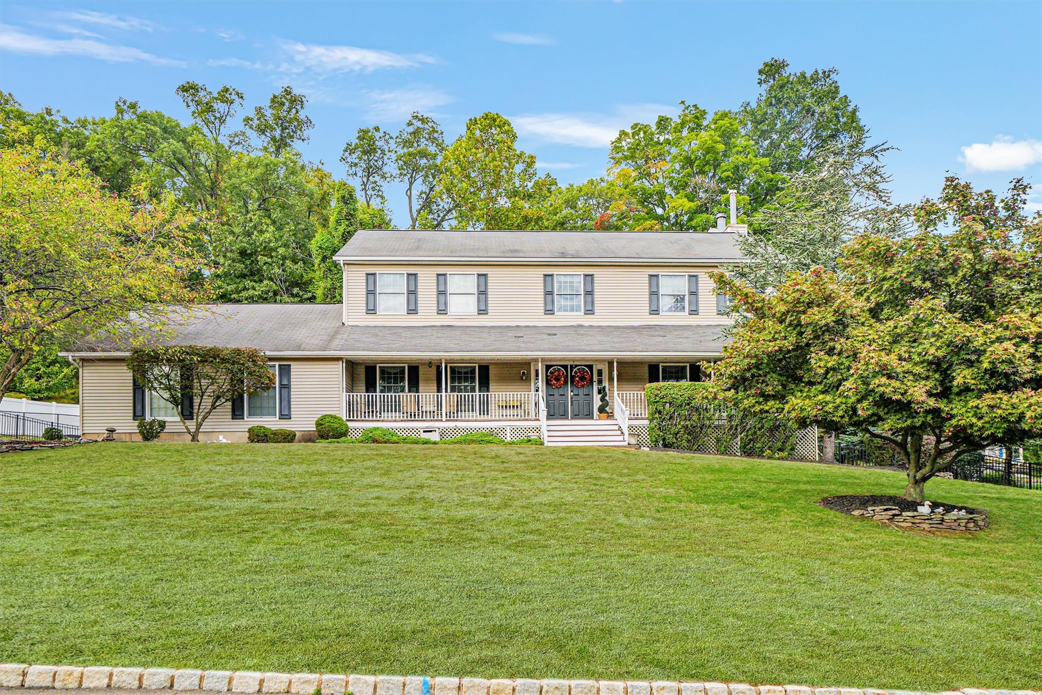 View of front of house featuring a front yard and a porch