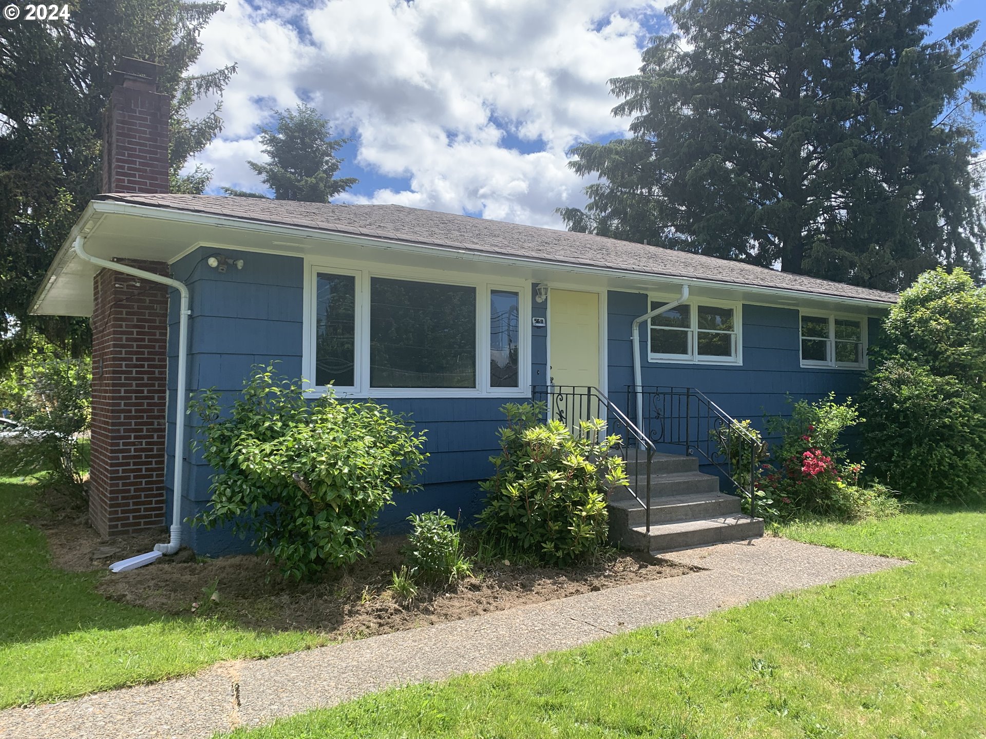 front view of a house with a yard