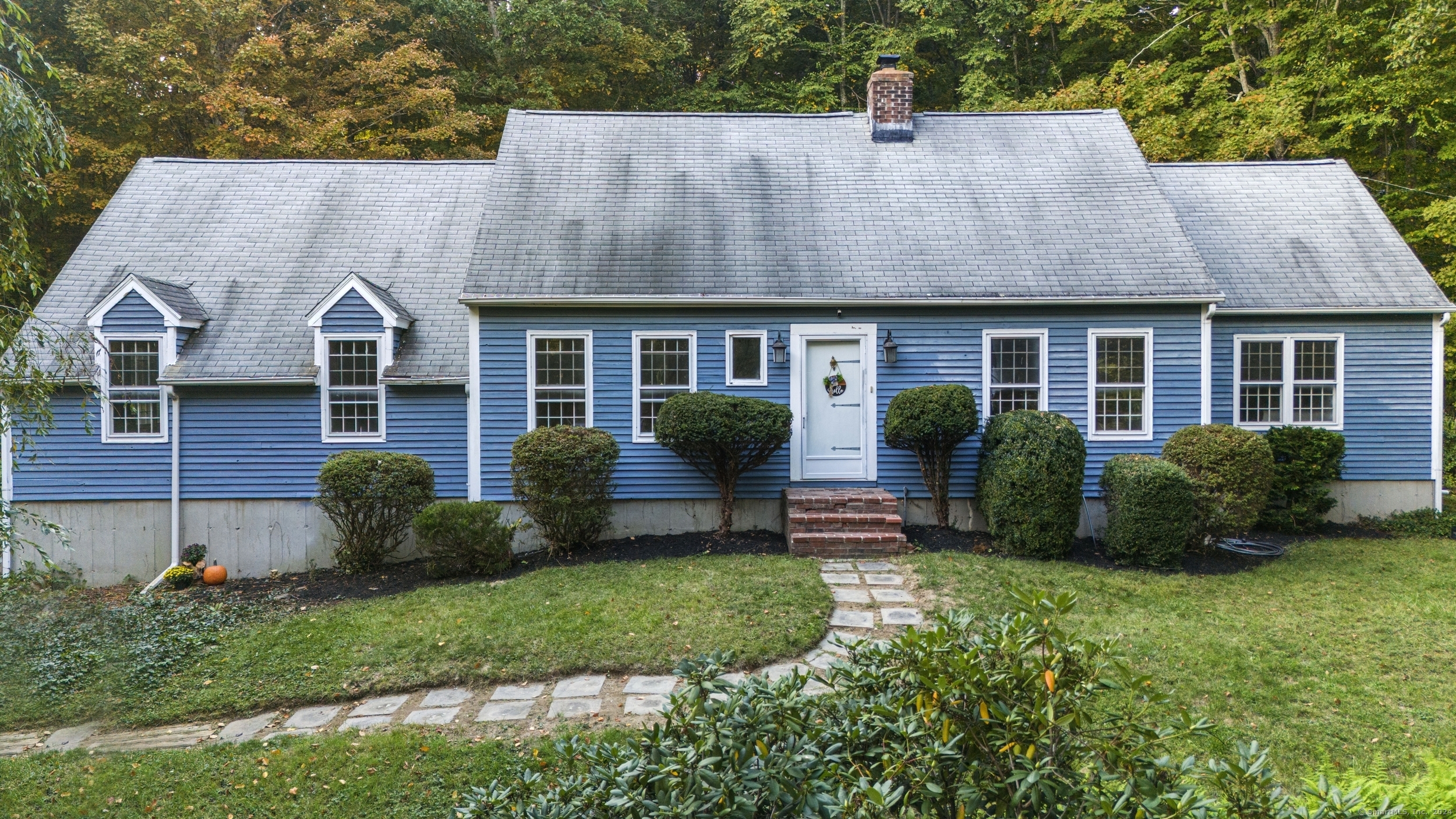 front view of a house with a yard