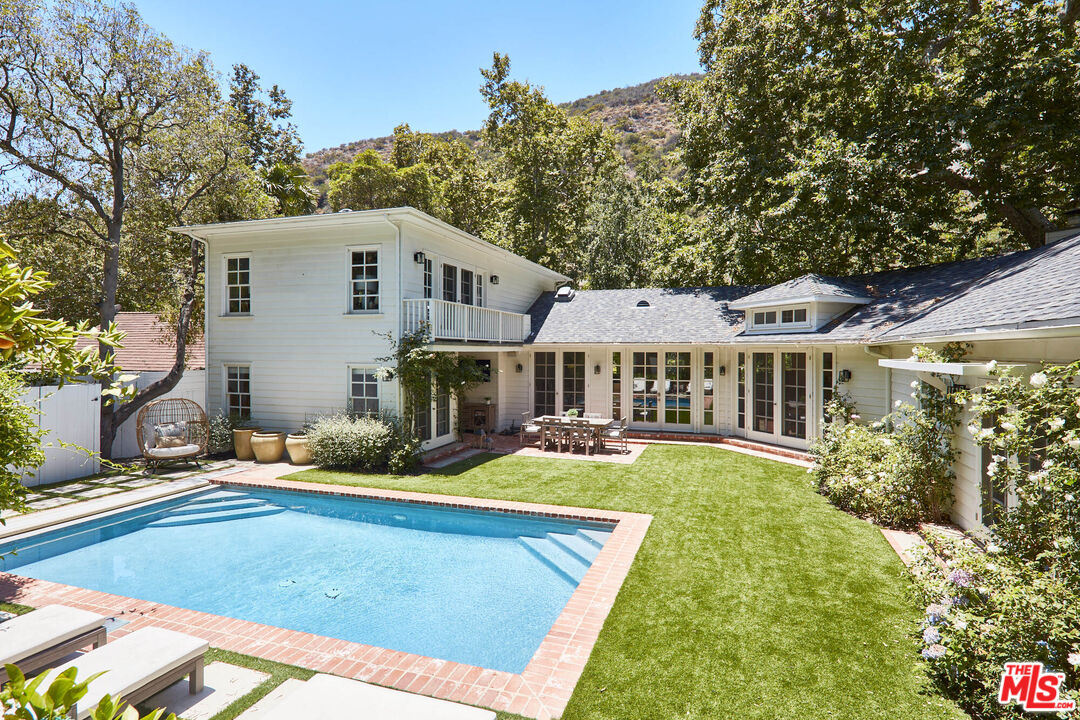 a front view of a house with swimming pool