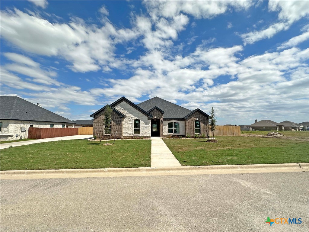 front view of a house with a yard